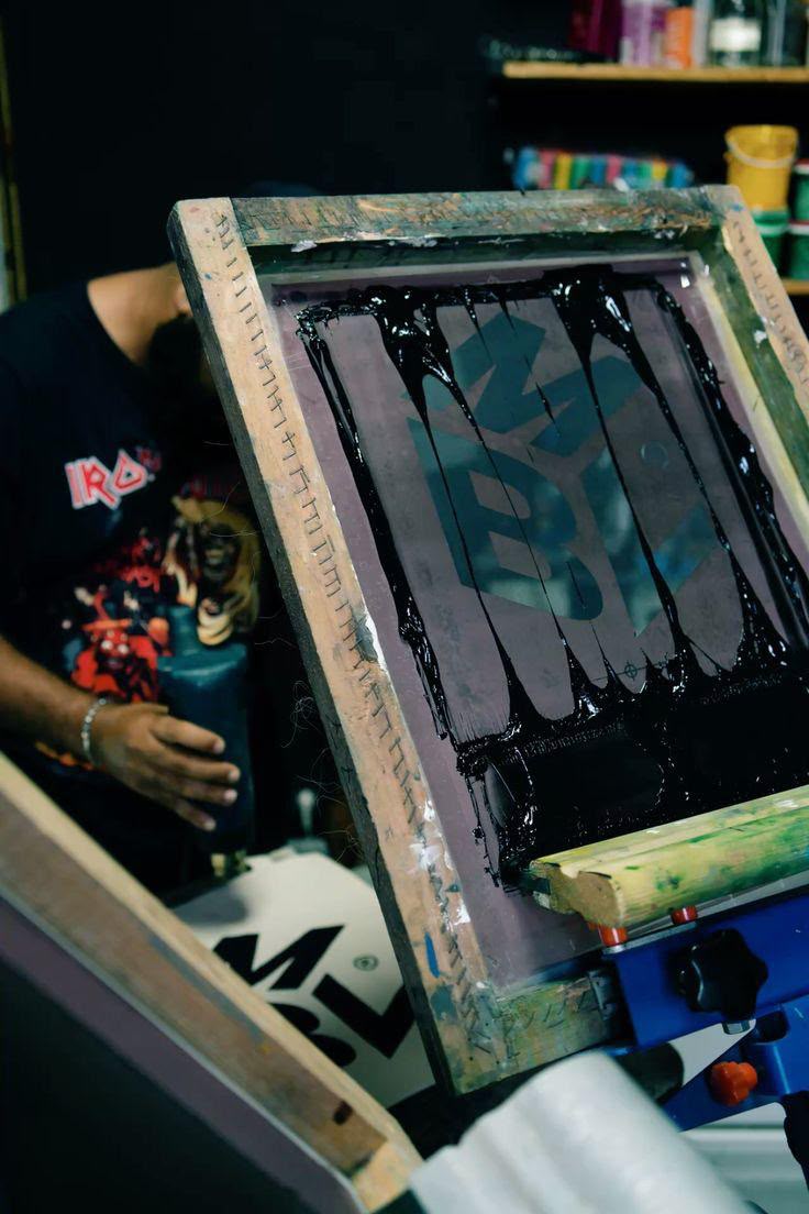 Screen printing a custom garment in the NAMLah production studio
